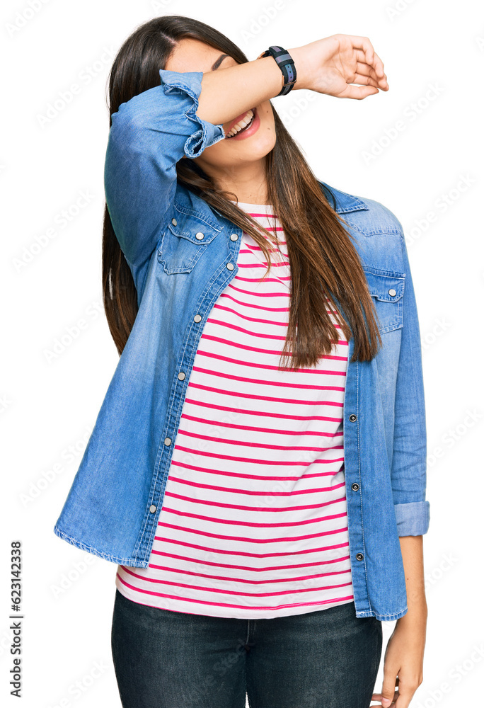 Φωτογραφία Young brunette woman wearing casual clothes covering eyes with arm smiling cheerful and funny