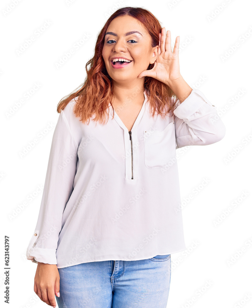 Young latin woman wearing casual clothes smiling with hand over ear listening an hearing to rumor or gossip. deafness concept.