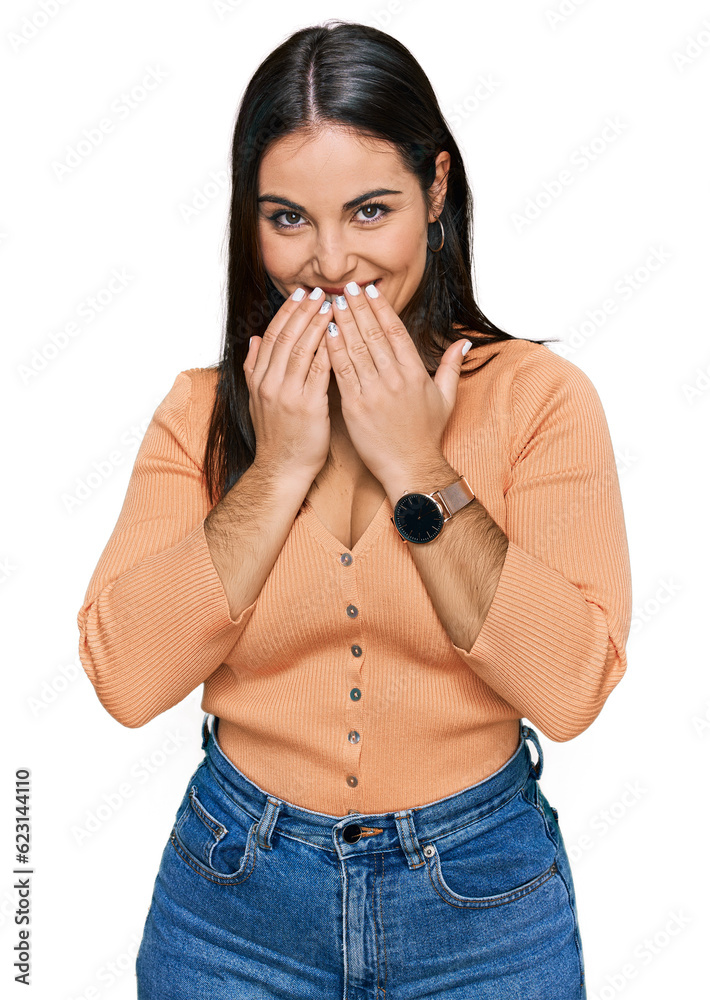 Young hispanic woman wearing casual clothes laughing and embarrassed giggle covering mouth with hands, gossip and scandal concept Young hispanic woman wearing casual clothes laughing and embarrassed giggle covering mouth with hands, gossip and scandal concept