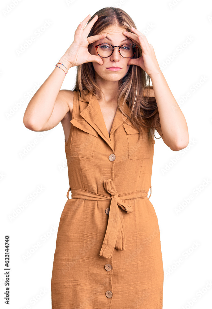 Young beautiful blonde woman wearing casual clothes and glasses trying to open eyes with fingers, sleepy and tired for morning fatigue Young beautiful blonde woman wearing casual clothes and glasses trying to open eyes with fingers, sleepy and tired for morning fatigue