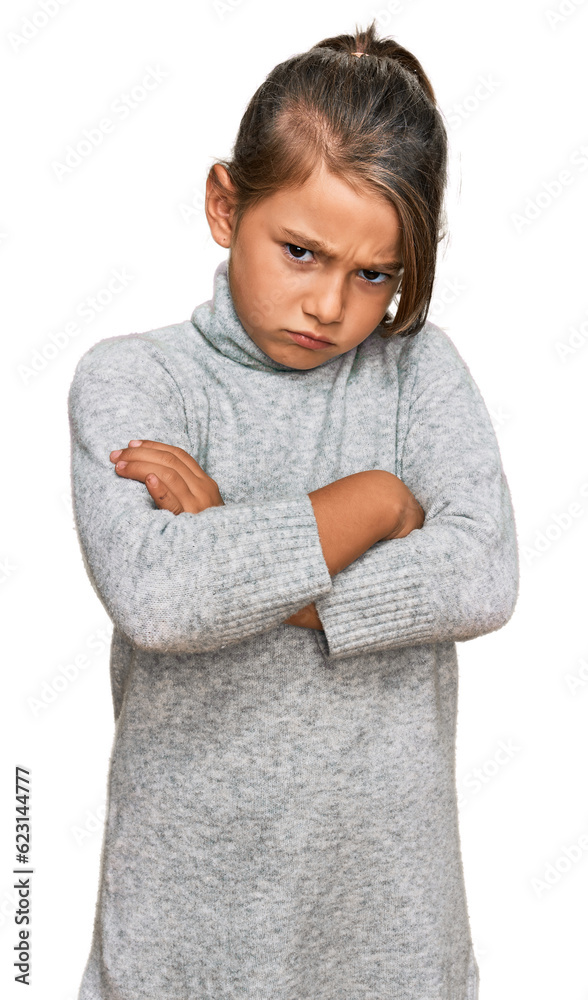Little beautiful girl wearing casual turtleneck sweater skeptic and nervous, disapproving expression on face with crossed arms. negative person. Little beautiful girl wearing casual turtleneck sweater skeptic and nervous, disapproving expression on face with crossed arms. negative person.