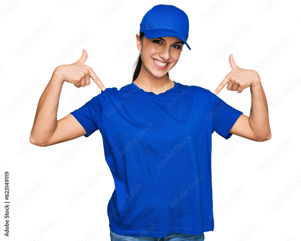 Young hispanic girl wearing delivery courier uniform looking confident with smile on face, pointing oneself with fingers proud and happy.