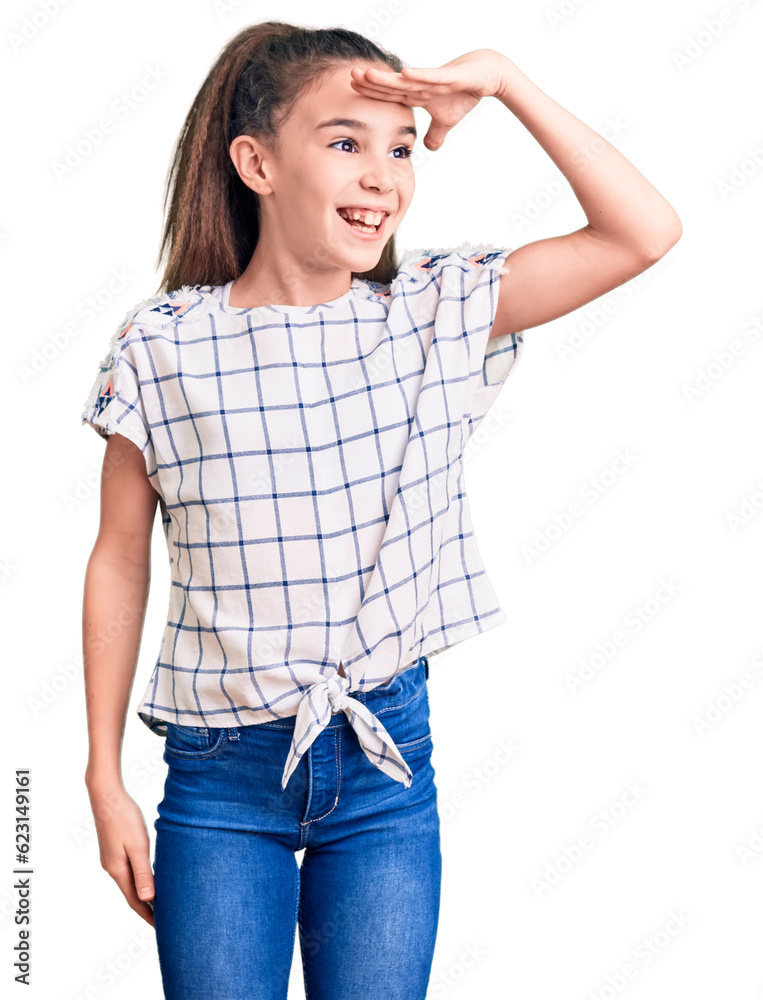 Cute hispanic child girl wearing casual clothes very happy and smiling looking far away with hand over head. searching concept. Cute hispanic child girl wearing casual clothes very happy and smiling looking far away with hand over head. searching concept.