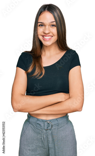 Young brunette woman wearing casual clothes happy face smiling with crossed arms looking at the camera. positive person. © Krakenimages.com