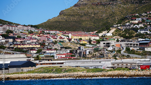 Local South African township housing residence area around Hout Bay hill side landscape from ocean photo