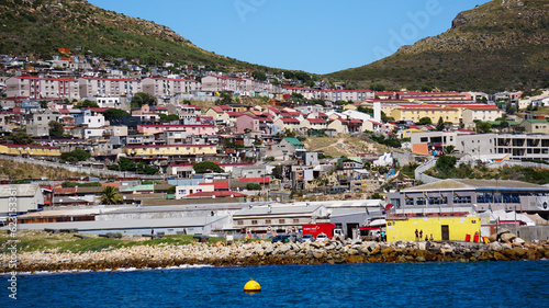 Local South African township housing residence area around Hout Bay hill side landscape from ocean photo