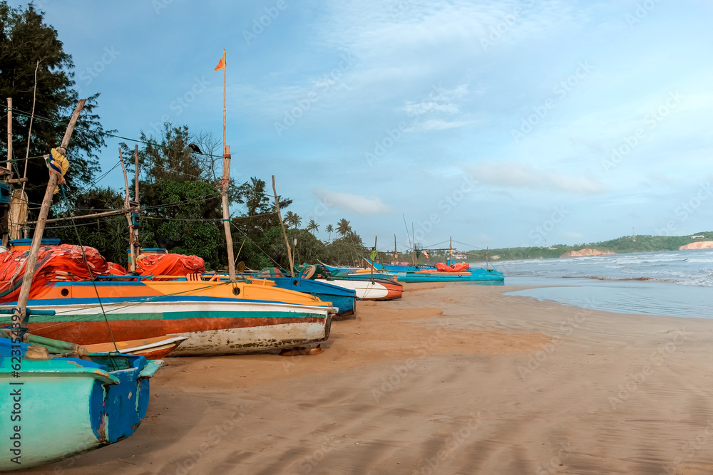 Fishing wooden boats by the ocean,Fishing boat in Sri Lanka,Fishing boats parked on the sand, fishing industry