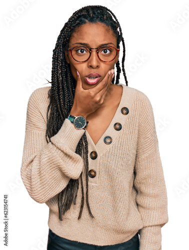 African american woman wearing casual clothes looking fascinated with disbelief, surprise and amazed expression with hands on chin