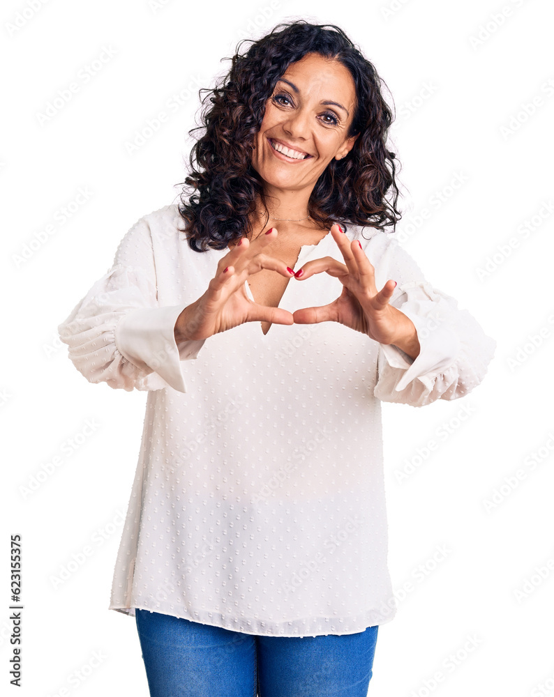 Middle age beautiful woman wearing casual sweater smiling in love doing heart symbol shape with hands. romantic concept. Middle age beautiful woman wearing casual sweater smiling in love doing heart symbol shape with hands. romantic concept.