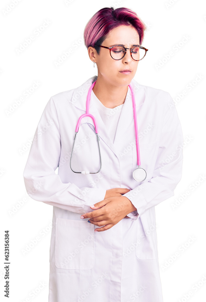 Young beautiful woman with pink hair wearing doctor uniform with hand on stomach because indigestion, painful illness feeling unwell. ache concept. Young beautiful woman with pink hair wearing doctor uniform with hand on stomach because indigestion, painful illness feeling unwell. ache concept.
