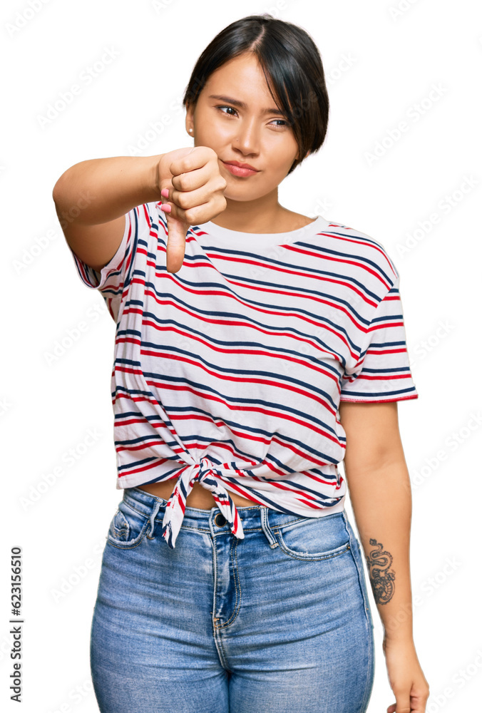 Fototapeta premium Beautiful young woman with short hair wearing casual clothes looking unhappy and angry showing rejection and negative with thumbs down gesture. bad expression.