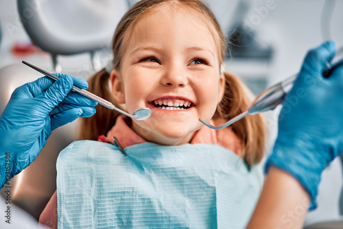 Children\'s dentistry. Live funny photo of a laughing child at the dentist\'s appointment.