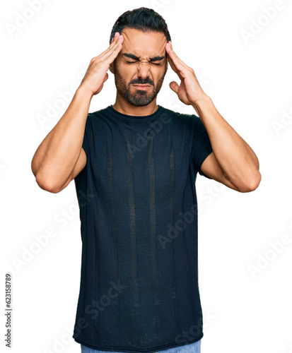 Photography Young hispanic man wearing casual clothes suffering from headache desperate and stressed because pain and migraine