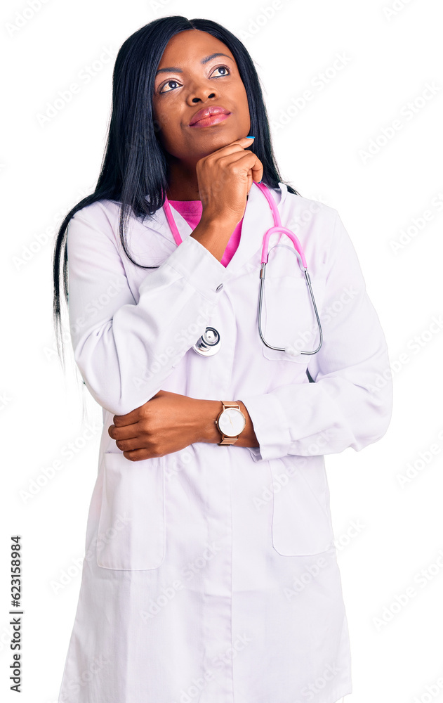 Young african american woman wearing doctor stethoscope with hand on chin thinking about question, pensive expression. smiling with thoughtful face. doubt concept. Young african american woman wearing doctor stethoscope with hand on chin thinking about question, pensive expression. smiling with thoughtful face. doubt concept.