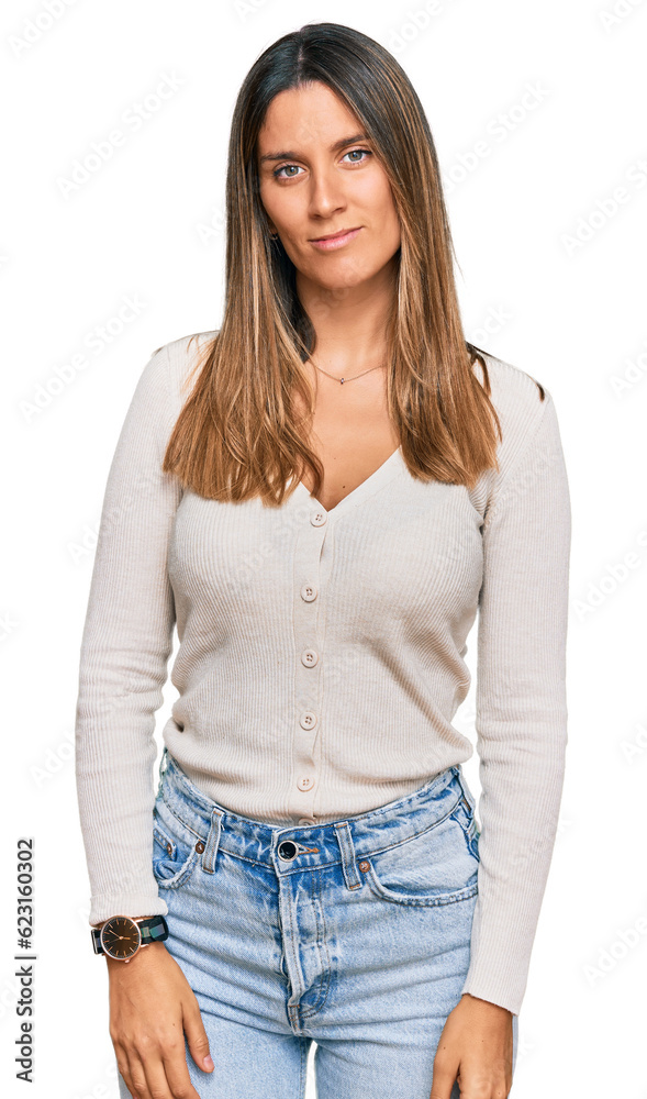 Young woman wearing casual clothes relaxed with serious expression on face. simple and natural looking at the camera. Young woman wearing casual clothes relaxed with serious expression on face. simple and natural looking at the camera.
