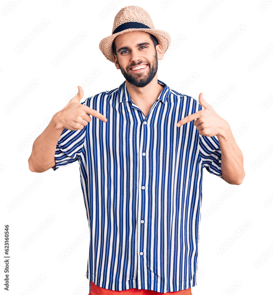 Young handsome man with beard wearing summer hat and striped shirt looking confident with smile on face, pointing oneself with fingers proud and happy. Young handsome man with beard wearing summer hat and striped shirt looking confident with smile on face, pointing oneself with fingers proud and happy.