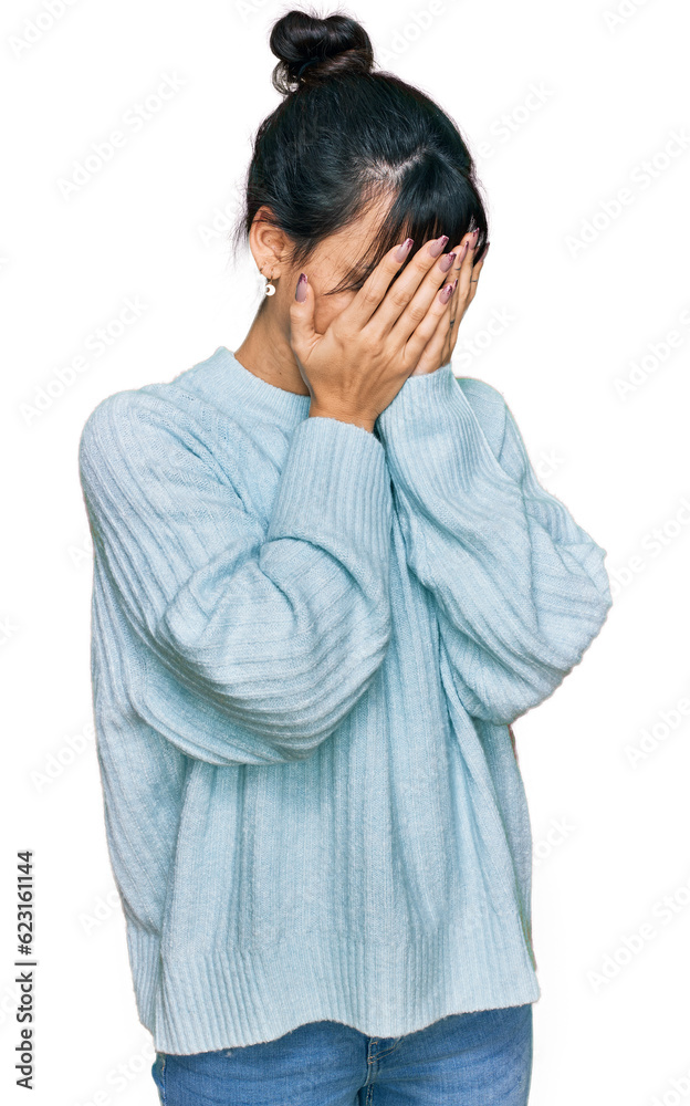Young hispanic woman wearing casual clothes with sad expression covering face with hands while crying. depression concept. Young hispanic woman wearing casual clothes with sad expression covering face with hands while crying. depression concept.