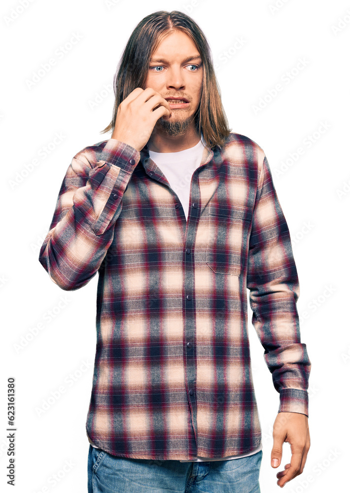Handsome caucasian man with long hair wearing hipster shirt looking stressed and nervous with hands on mouth biting nails. anxiety problem. Handsome caucasian man with long hair wearing hipster shirt looking stressed and nervous with hands on mouth biting nails. anxiety problem.