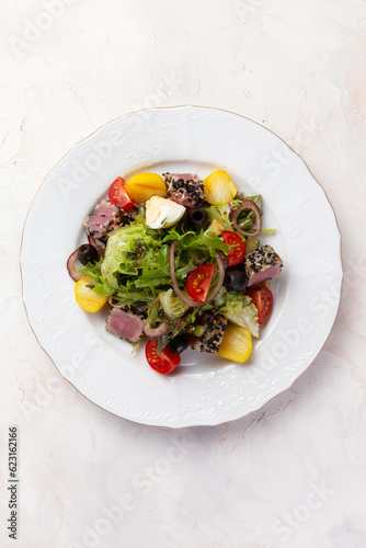 Salad with tuna and tomatoes.