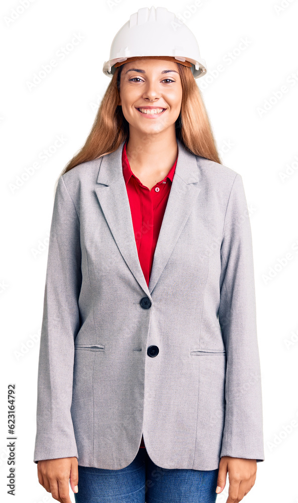 Beautiful young woman wearing architect hardhat with a happy and cool smile on face. lucky person. Beautiful young woman wearing architect hardhat with a happy and cool smile on face. lucky person.