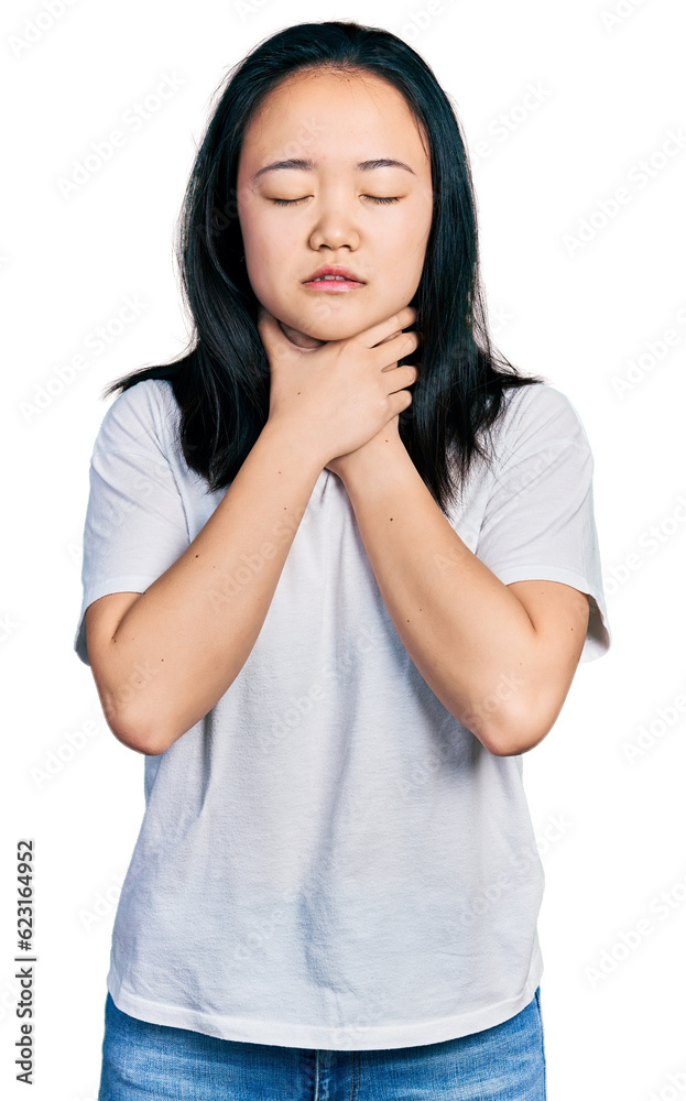Young chinese woman wearing casual white t shirt shouting and suffocate because painful strangle. health problem. asphyxiate and suicide concept. Young chinese woman wearing casual white t shirt shouting and suffocate because painful strangle. health problem. asphyxiate and suicide concept.