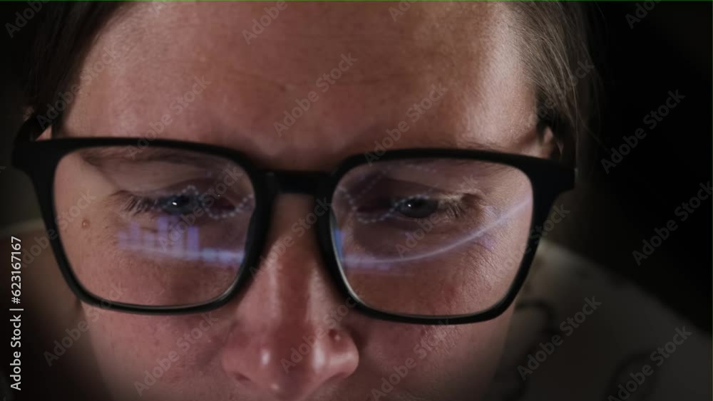 Close-up of girl in glasses studying financial markets. Abstract financial background with online stock market information. Trading report for business concept. Close-up of girl in glasses studying financial markets. Abstract financial background with online stock market information. Trading report for business concept.