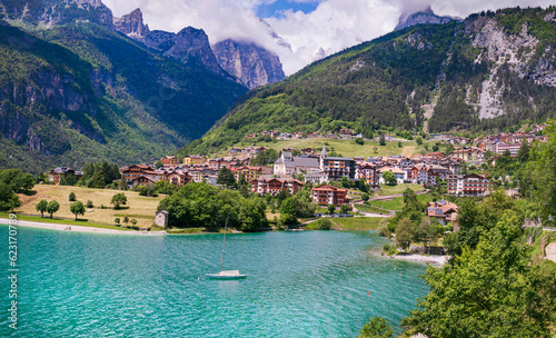 Most scenic mountain lakes in northern Italy - beautiful Molveno in Trento, Trentino Alto Adige region. surounded by Dolomites mountains