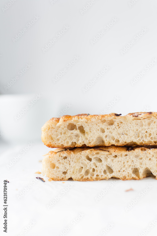 Cross section of focaccia on a white background, fresh homemade focaccia bread Cross section of focaccia on a white background, fresh homemade focaccia bread