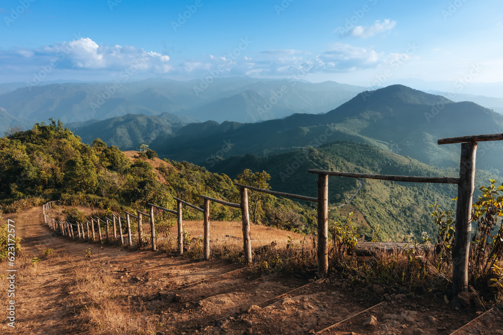Mountain landscape with hiking trail and view of beautiful forest, Mountain path, Hiking trail through forested peaks, Trial to the peak in high Mountains at Doi Pui Co, Thailand