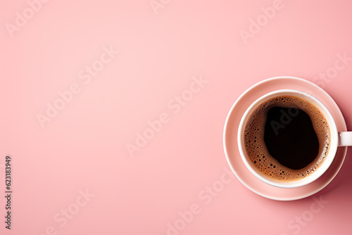 hot coffee in mug on pink background. Top view. Copy space