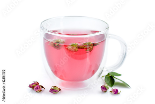 Cup of roses tea with rose buds on white background
