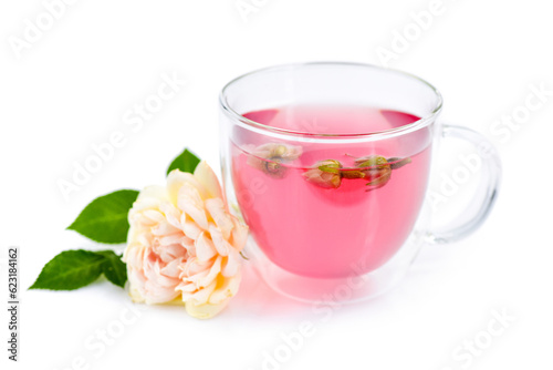 Cup of roses tea with rose buds on white background
