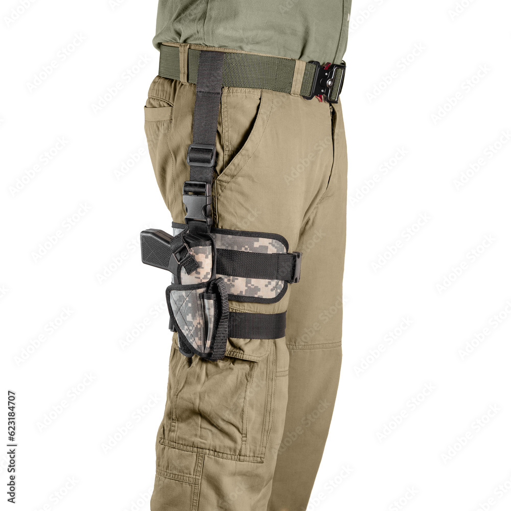 Man carrying pistol weapon in holster at hip. Tactical equipment Man carrying pistol weapon in holster at hip. Tactical equipment