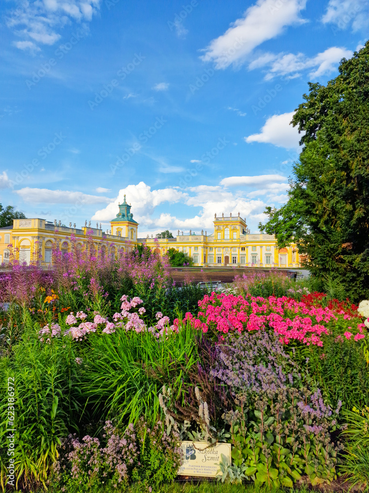 WARSAW, WILANOW, POLAND  July 11, 2023 : beautiful flowers in the foreground Wilanow Palace in Warsaw, Poland