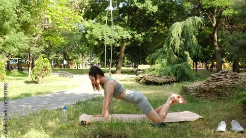 Woman doing pushups in a park.Slow motion 4K.