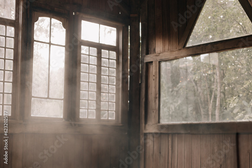 interior of a barn with plenty of natural light coming in. smokes in rays of sun. photo