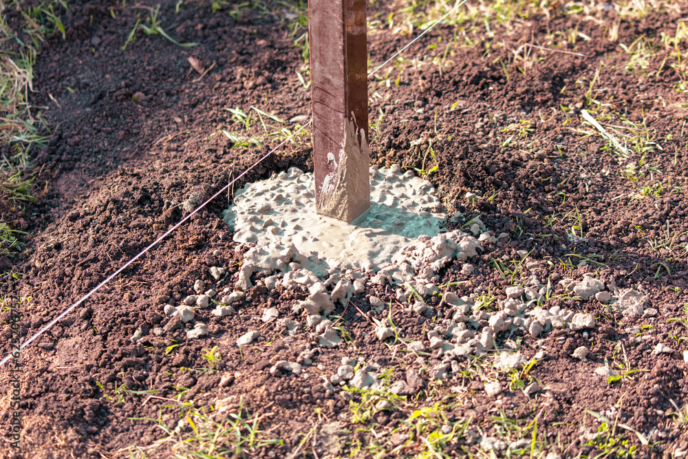 Fototapeta premium Pillar filled with concrete in the ground