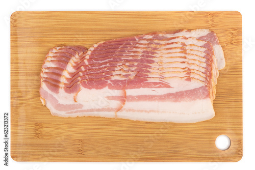 Sliced bacon on a cutting board over a white background.