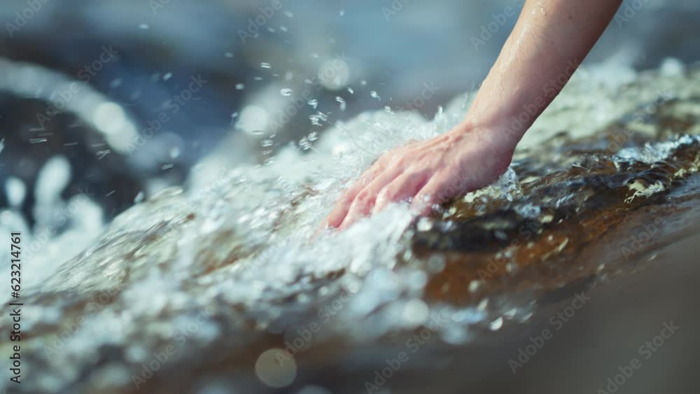 B roll - Close up hand of traveler woman touching water in the forest from waterfall, Slow motion, Tourist travel enjoying nature and life concept. Go everywhere.