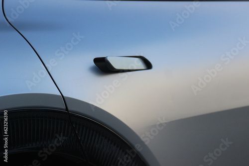 Door handle on modern electric car. Beautiful sleek door handle of electric car background image. EV background. 