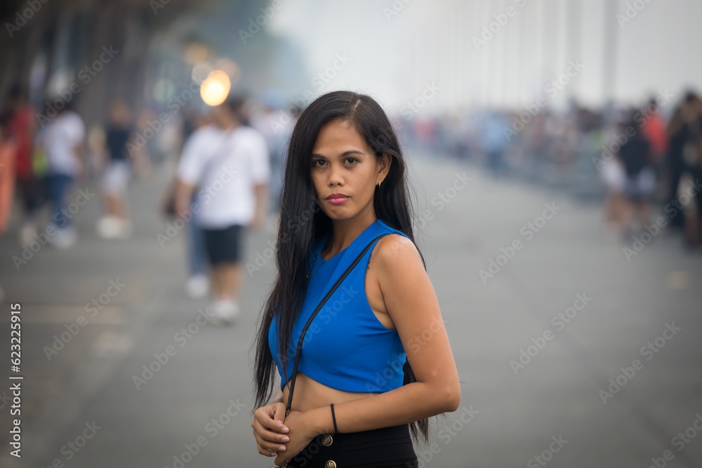 girl looking to the camera on a busy street