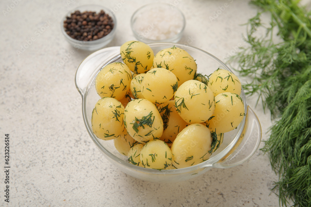 Bowl with boiled baby potatoes on light background Bowl with boiled baby potatoes on light background