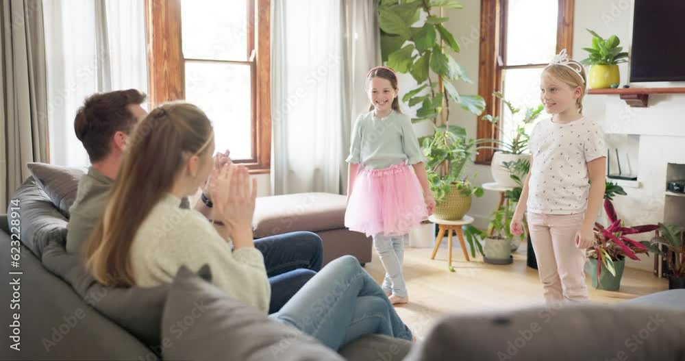 Parents clapping for their kids in the living room after a dance show in princess costume. Happy, cheering and girl children taking bow after performance for mother and father relaxing in family home Parents clapping for their kids in the living room after a dance show in princess costume. Happy, cheering and girl children taking bow after performance for mother and father relaxing in family home