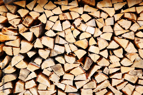 laid dry firewood lie on the pile