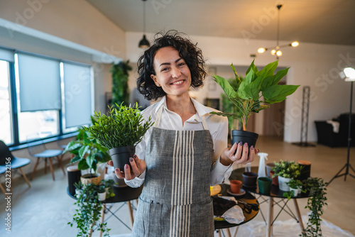 portrait of woman mature caucasian female take care of plants at home