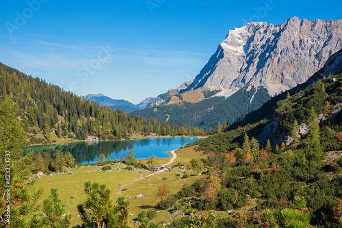 view from hiking trail to Zugspitze mountain and lake Seebensee in autumn