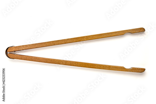 Shabby old wooden tongs for washing isolated on white background Top view with copy space photo