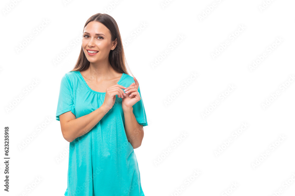portrait of a 30 year old pretty brunette woman with black flowing hair on a background with copy space portrait of a 30 year old pretty brunette woman with black flowing hair on a background with copy space
