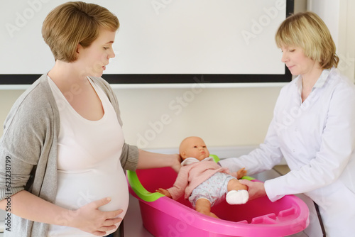 Pregnant woman on lesson courses for expectant mothers. Medical insurance childbearing. Family doctor for gestation. Maternity leave. Pediatrics.