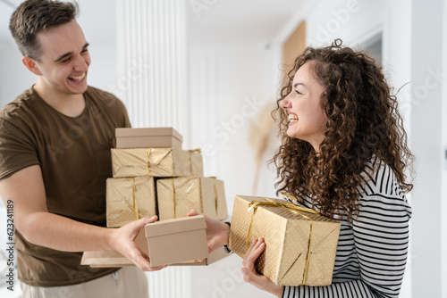 man and woman give gift box presents at home holiday surprise concept © Miljan Živković